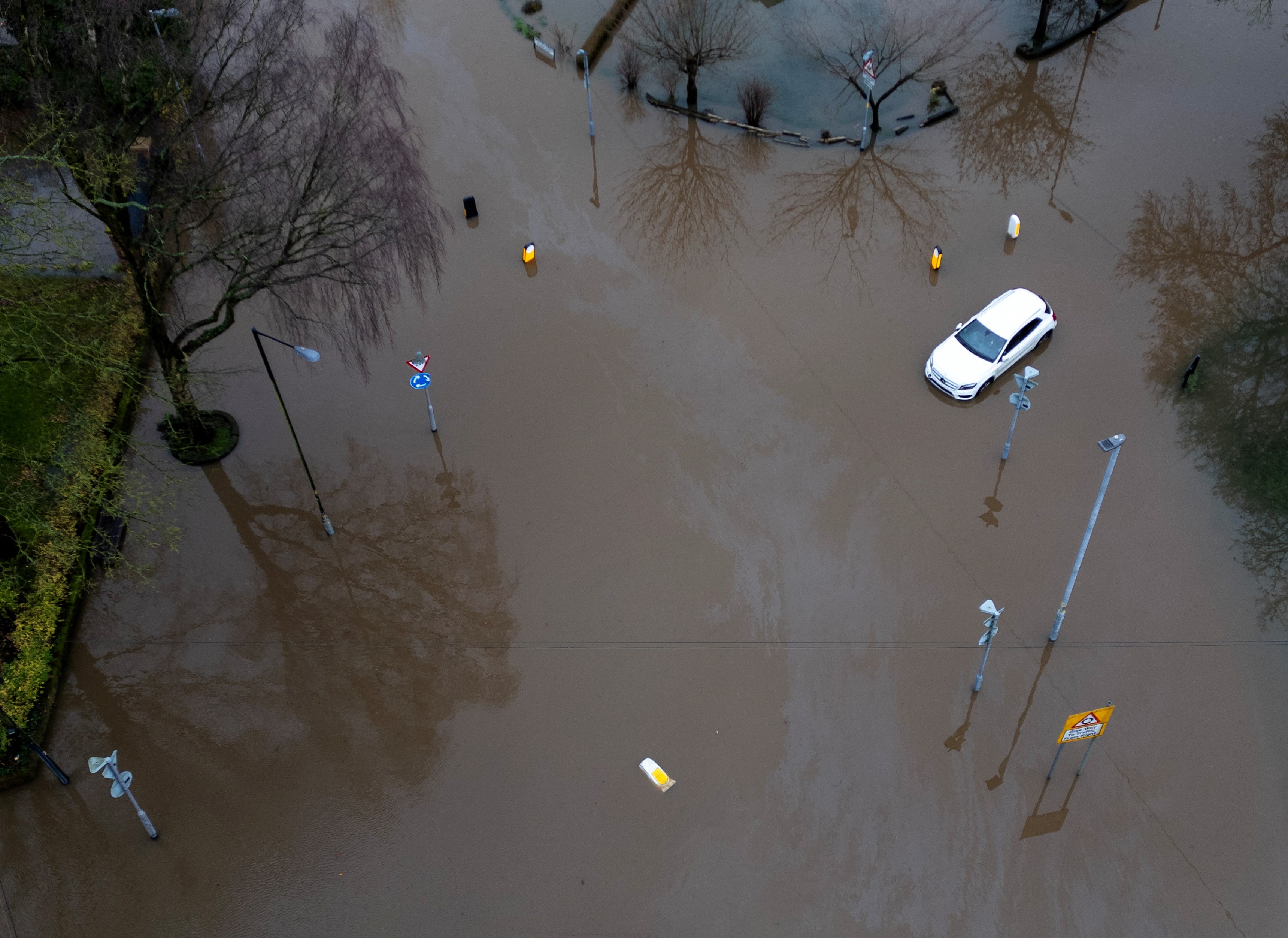 Heavy overnight rain caused roads to flood, leaving cars stranded in Manchester