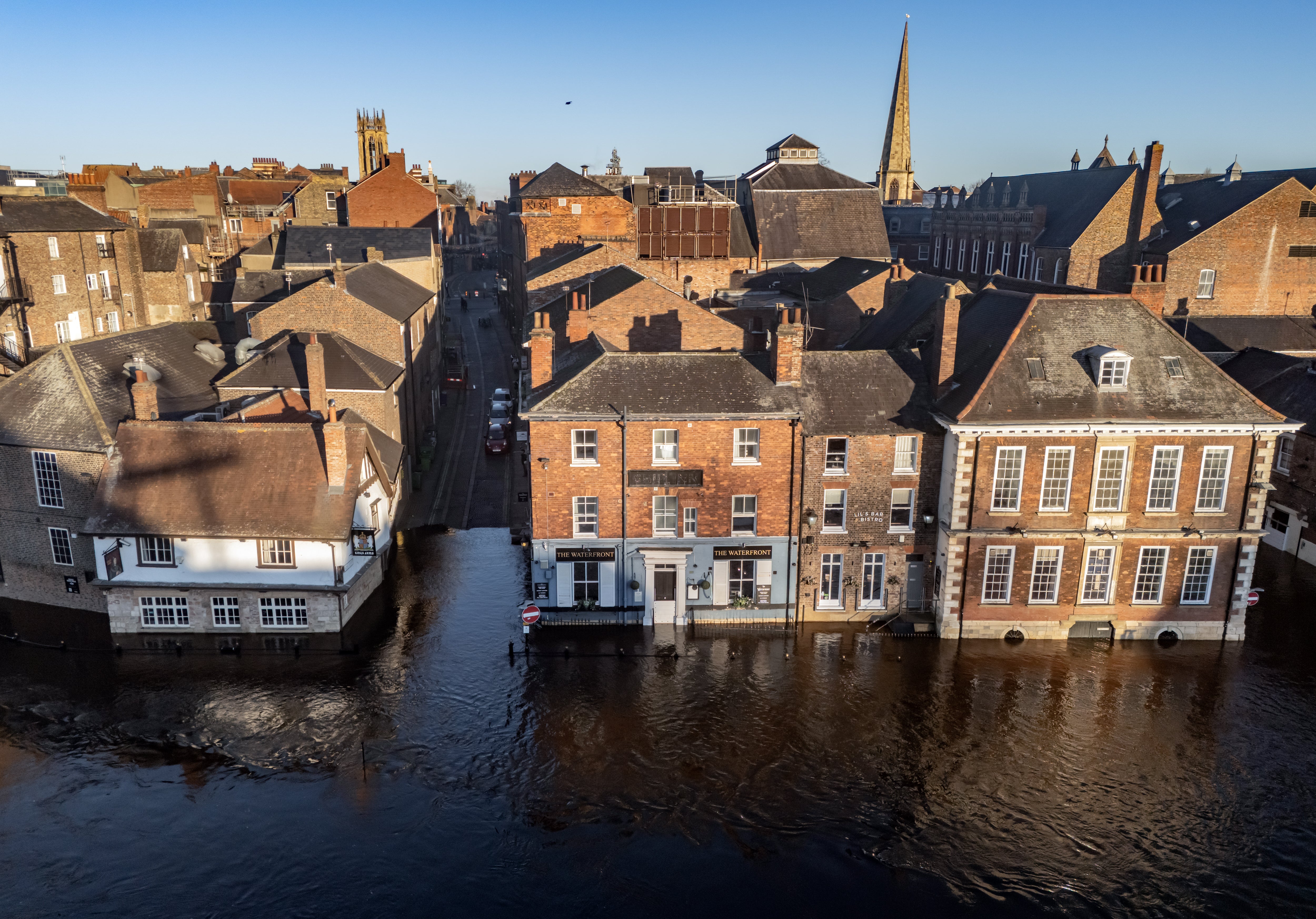 Floodwater in York after the River Ouse burst its banks. A three-day yellow warning for snow has been issued for almost all of England and Wales and parts of Scotland this weekend