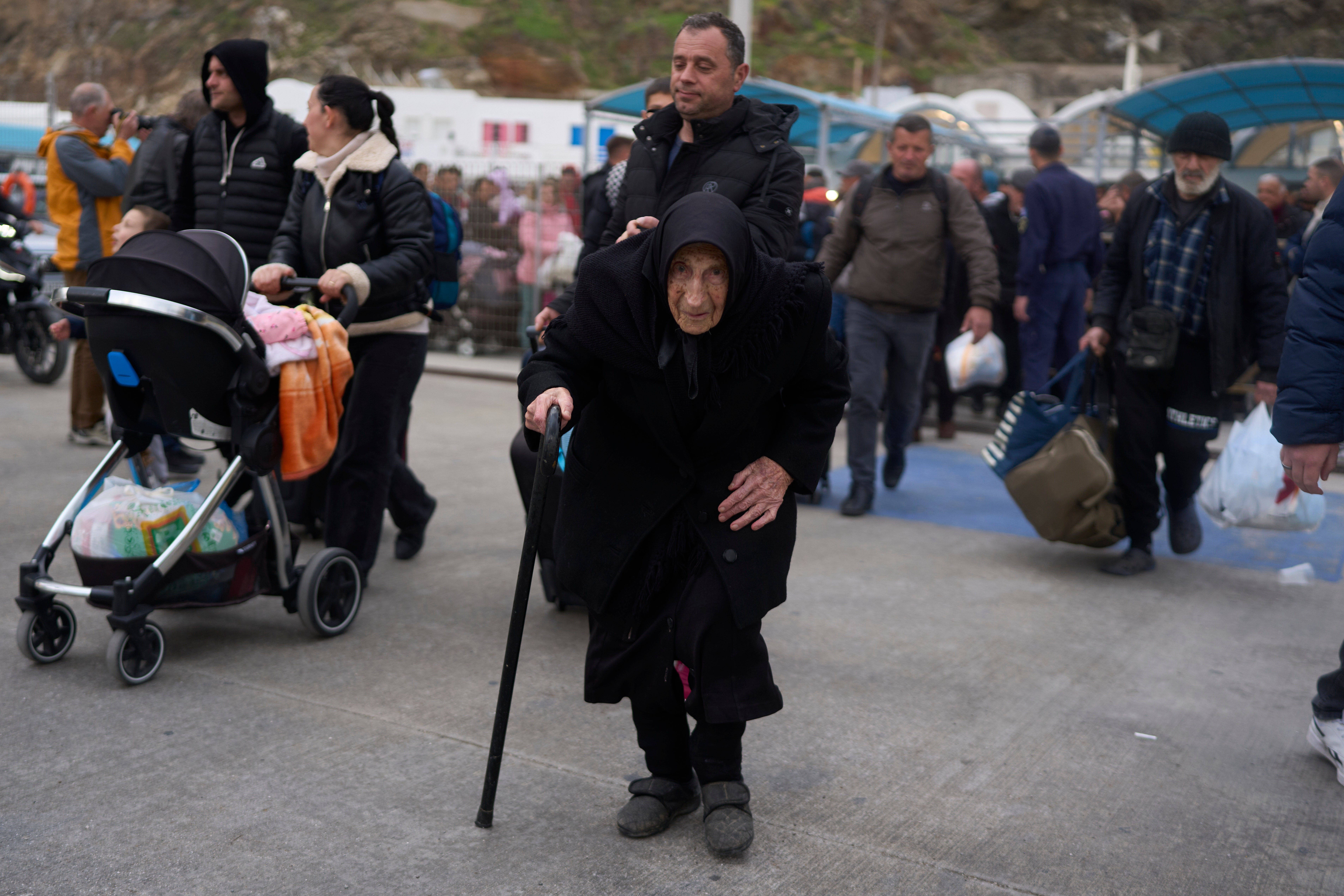 Flora Karamolegou, 94, said she survived a deadly earthquake on Santorini in 1956. She is seen boarding a ferry bound for the mainland