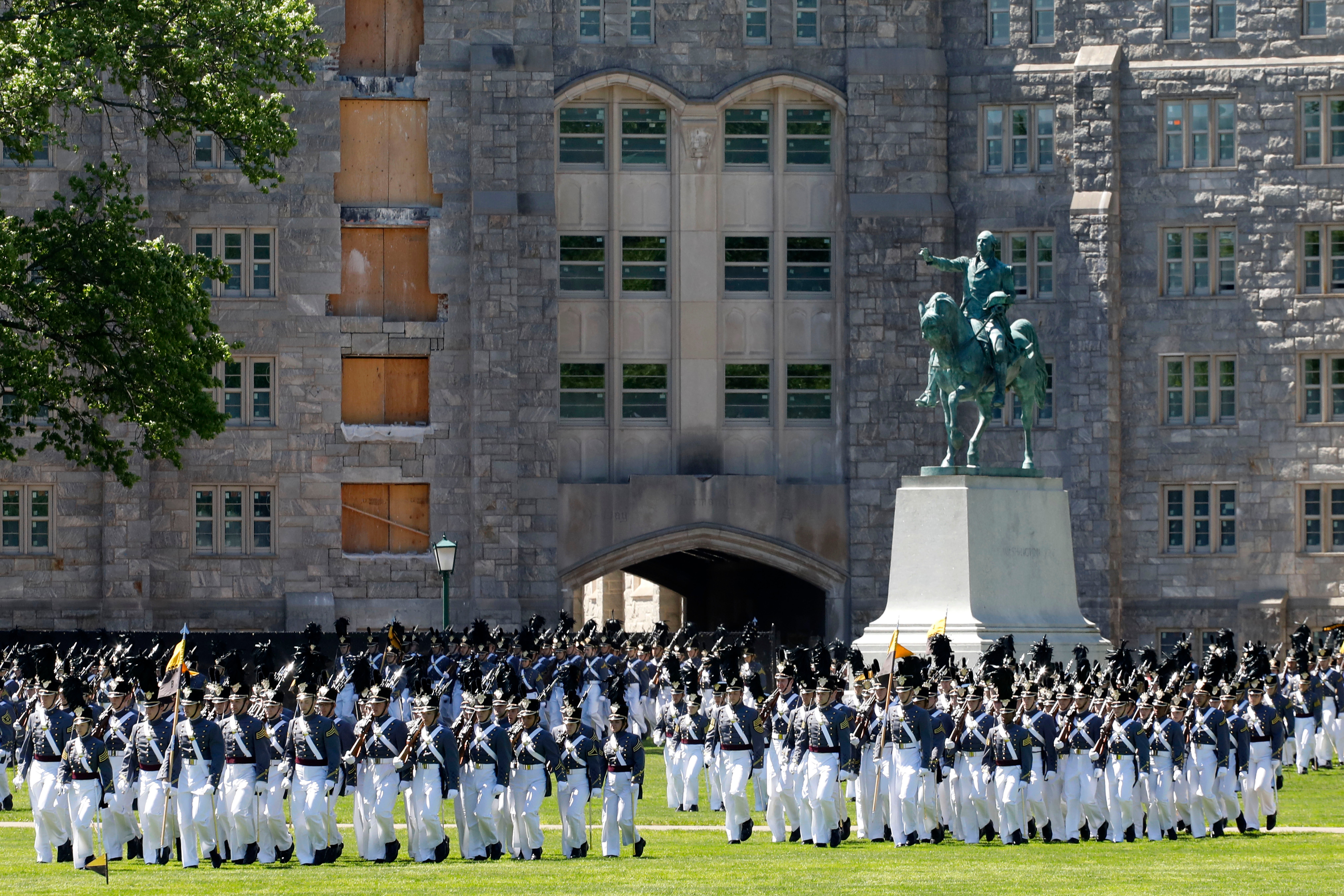 Members of the senior class march past a statue of George Washington during Parade Day at the U.S. Military Academy in West Point in 2019