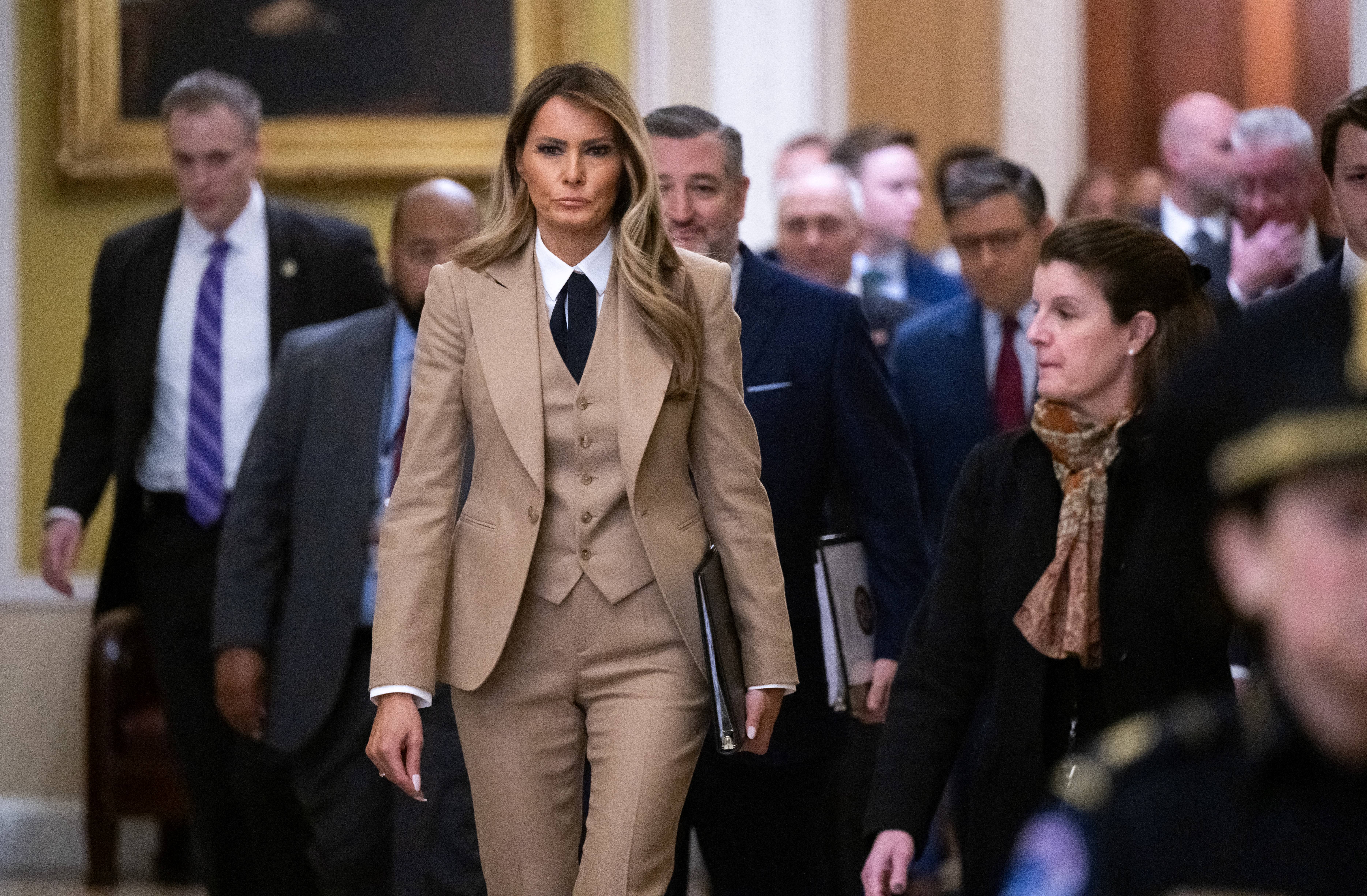 Melania Trump walks to a meeting to urge passage of the Take It Down Act by the US Senate. The act would seek to protect victims of real and deepfake "revenge pornography" by criminalizing their publication