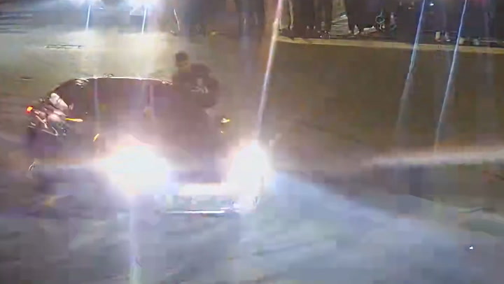 Street racers hang from car windows as drivers use roads as ‘personal race track’