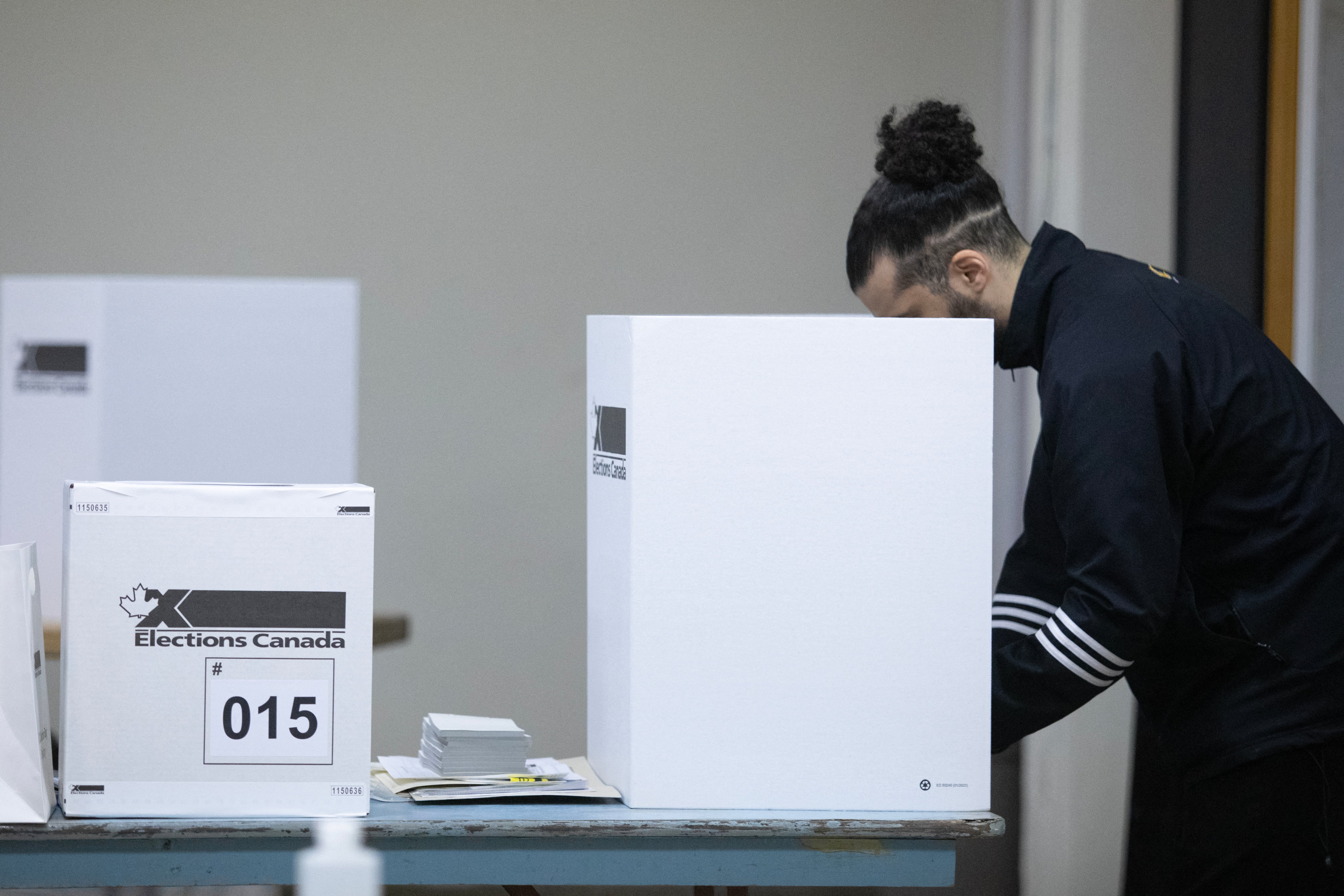 People cast their vote at a polling place on federal election day in Montreal, Canada