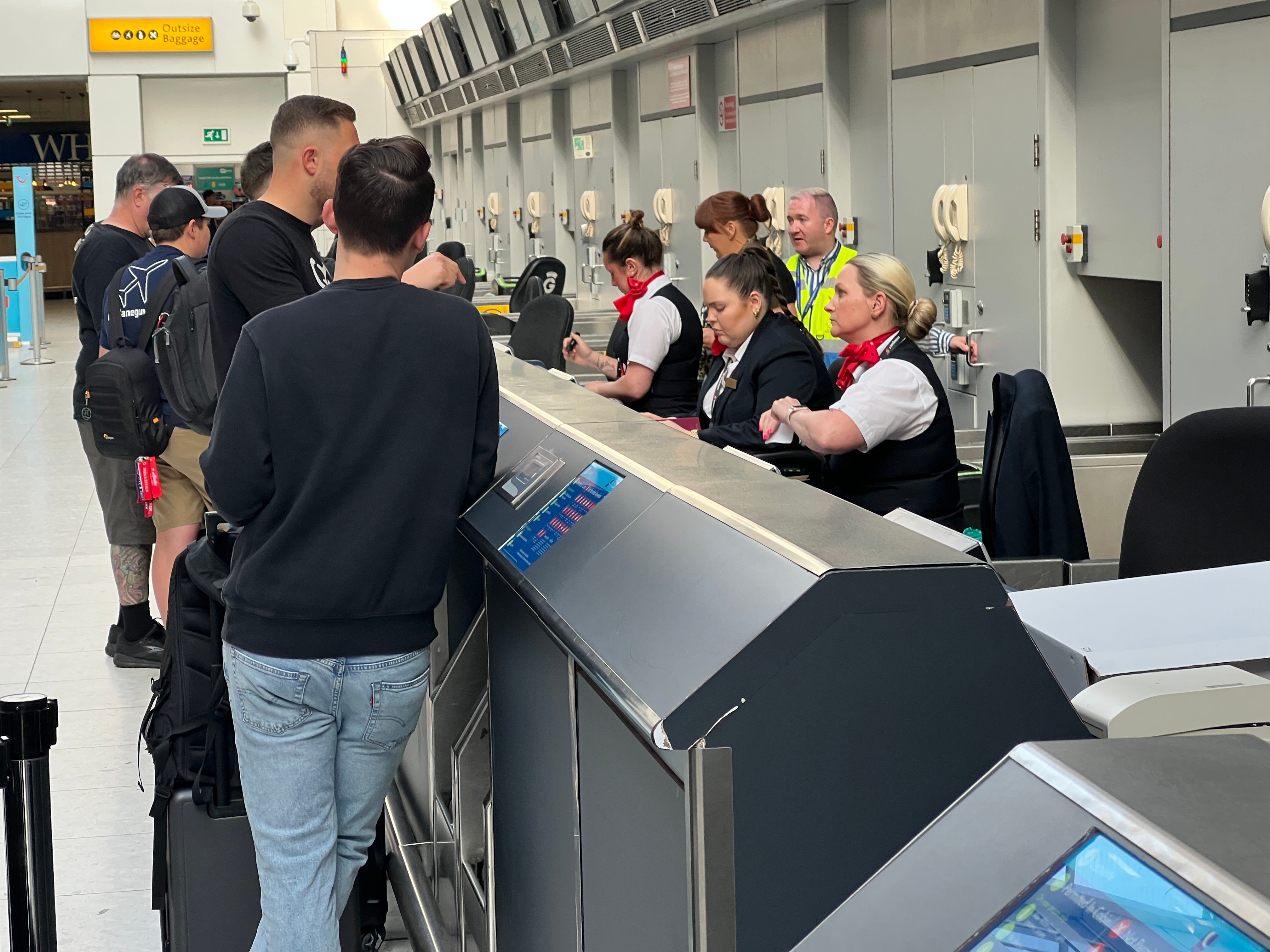 Passengers checking in for the first transatlantic flight by a Global Airlines