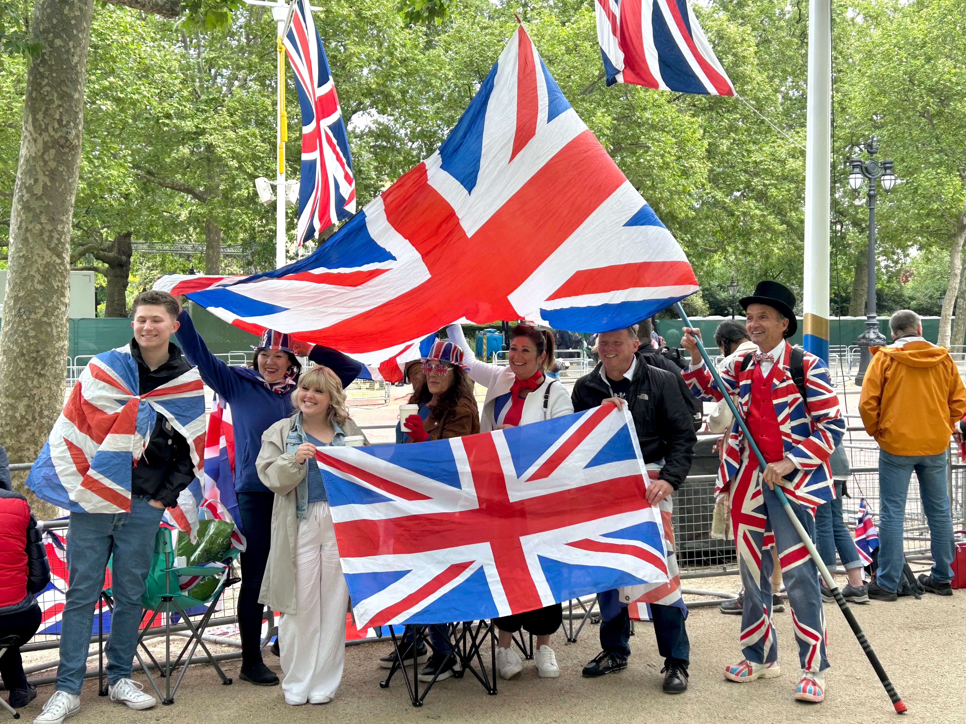 Crowds gather at The Mall outside Buckingham Palace ahead of the military procession